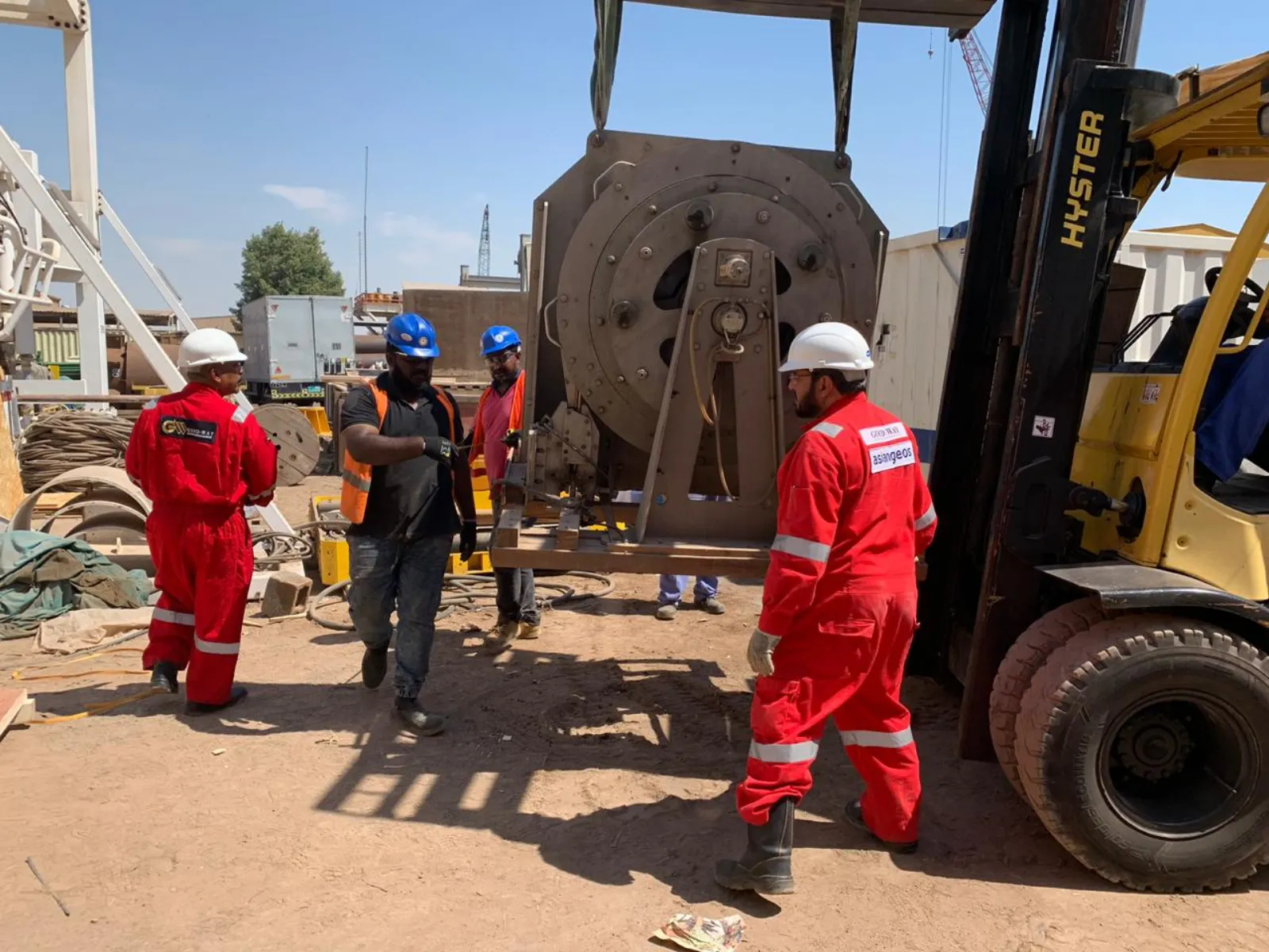 ASIANGEOS technicians handling rental equipment with forklift