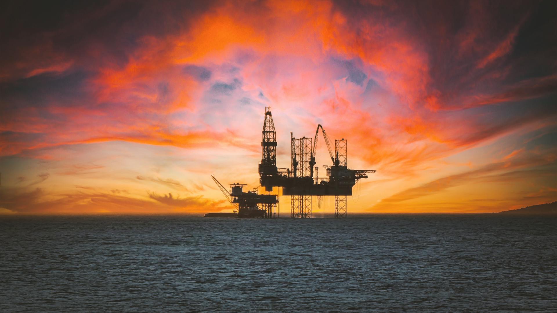 Offshore oil platform at sunset